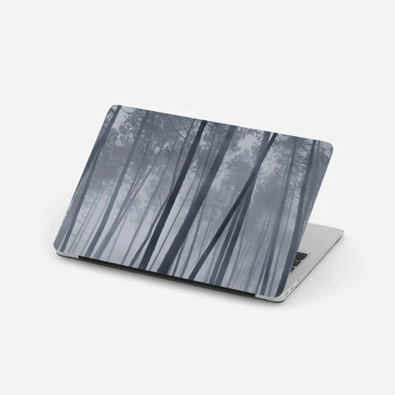 Laptop sticker misty pine forest at night