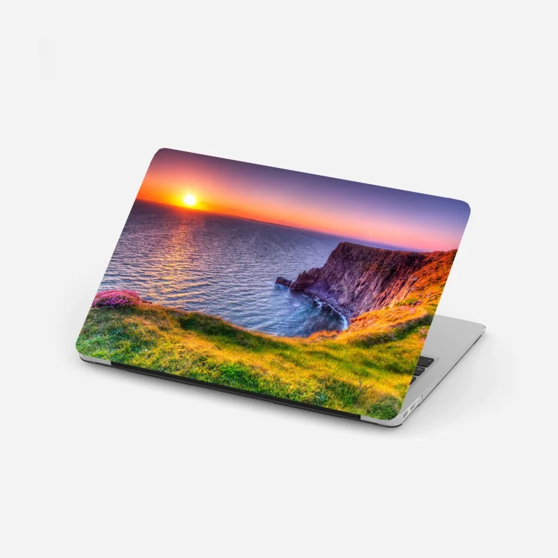 Laptop sticker sunset over rugged coastal cliffs