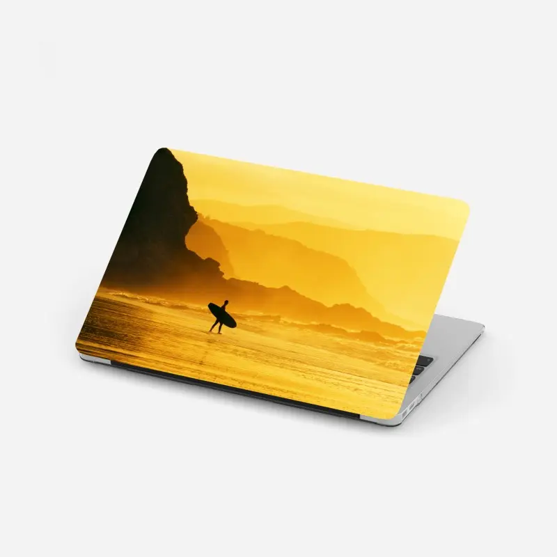 Laptop sticker surfer at golden sunset