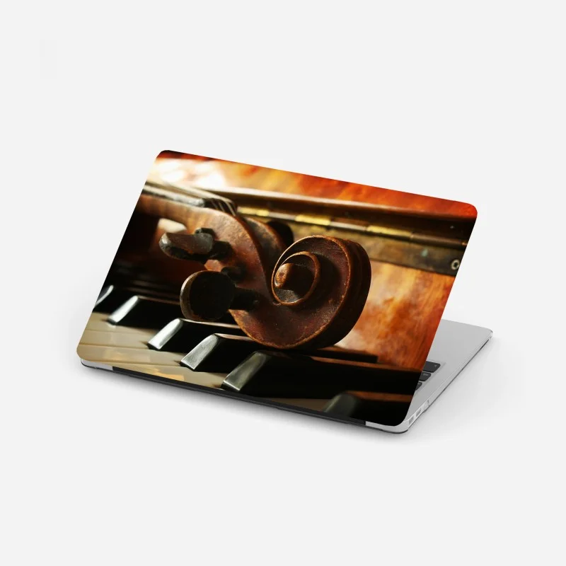 Laptop sticker vintage violin scroll on piano keys