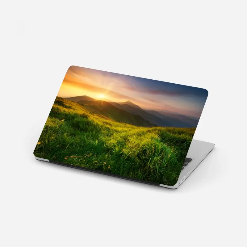 Laptop sticker sunrise over emerald mountain valley