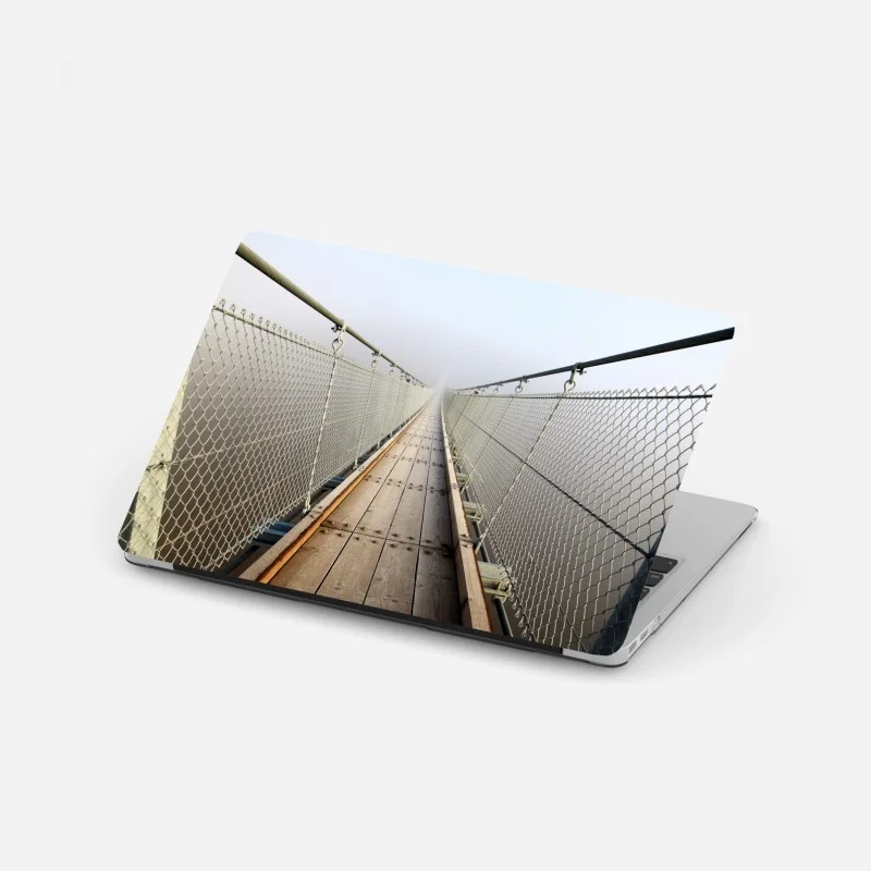 Laptop sticker misty suspension bridge leading into fog