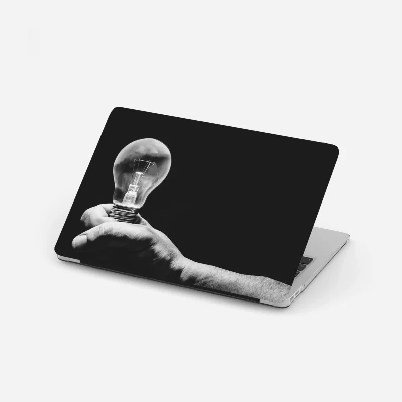 Laptop sticker monochrome hand holding light bulb