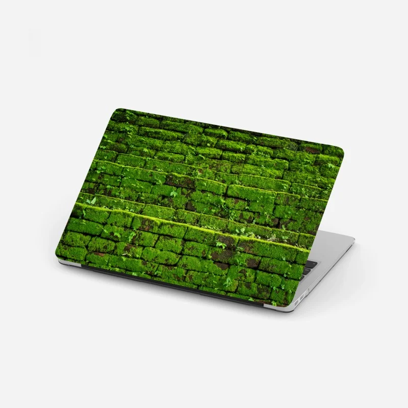 Laptop sticker lush moss-covered brick wall