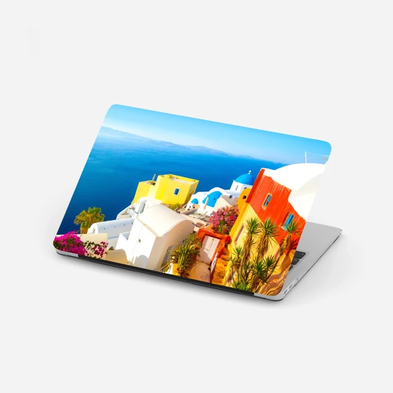 Laptop sticker sunlit Santorini seaside village