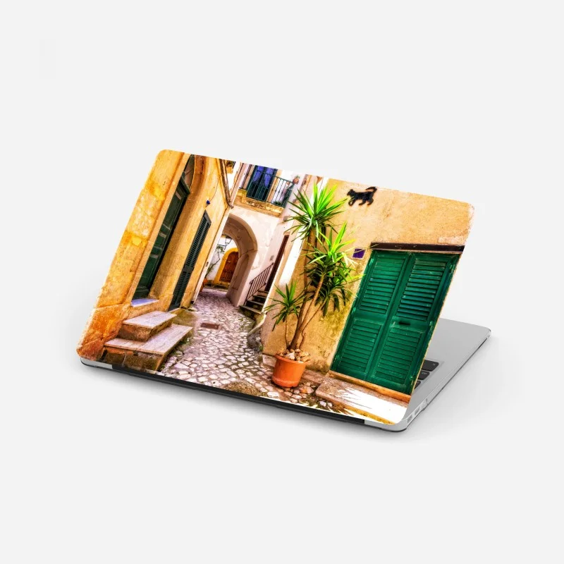 Laptop sticker sunlit mediterranean alley with green shutters
