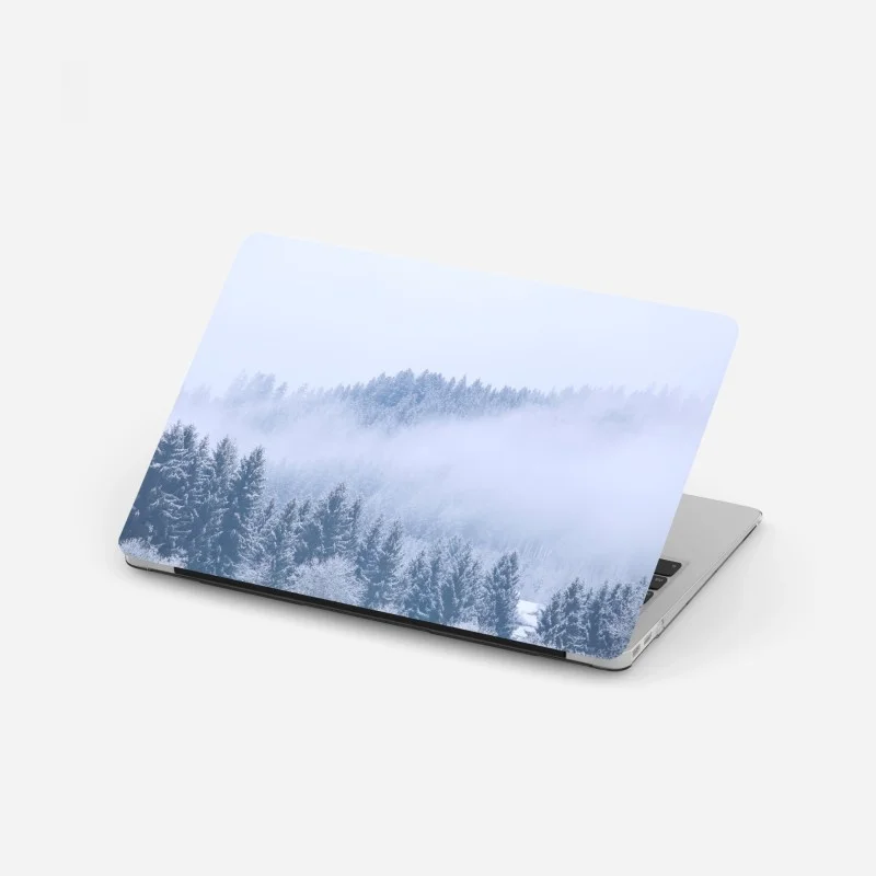 Laptop sticker winter mist over coniferous forest