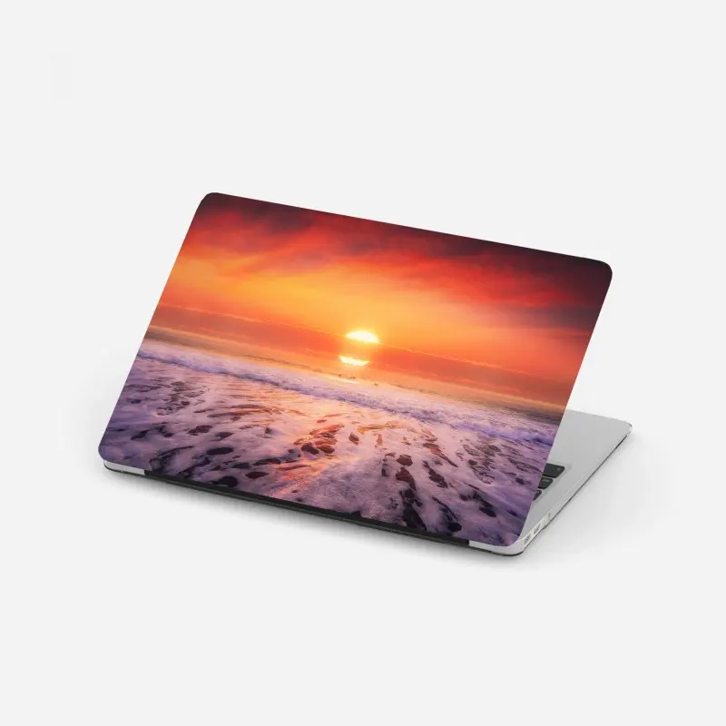 Laptop sticker golden sunset over tranquil beach