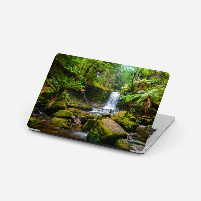 Laptop sticker lush forest waterfall retreat