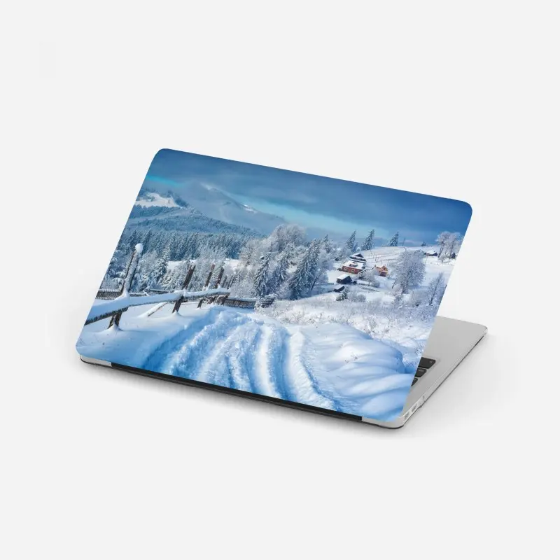 Laptop sticker winter path to an alpine village