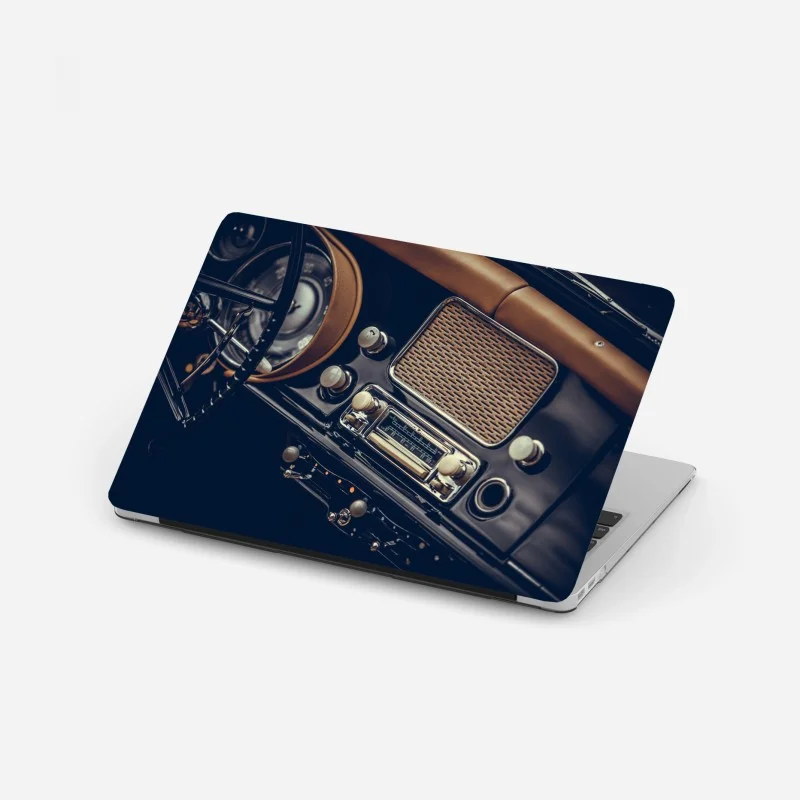 Laptop sticker vintage car dashboard close-up