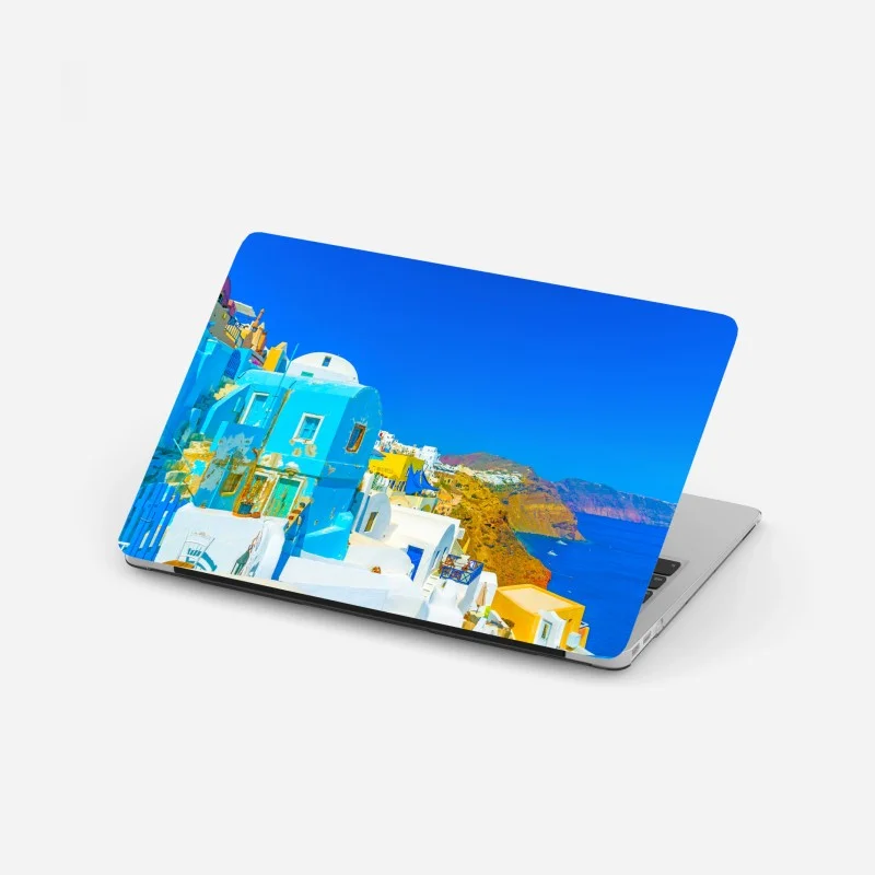 Laptop sticker sunlit view of Oia, Santorini coast