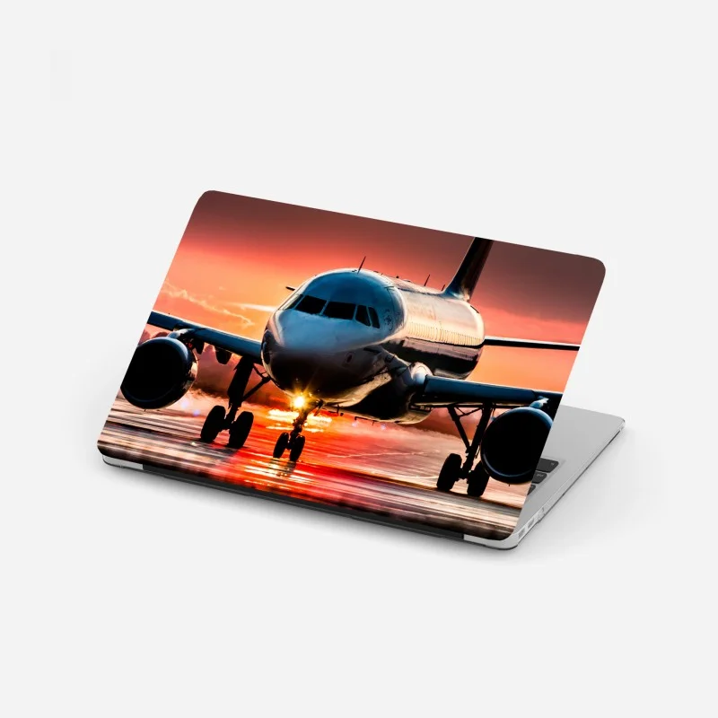 Laptop sticker sunset jet on runway