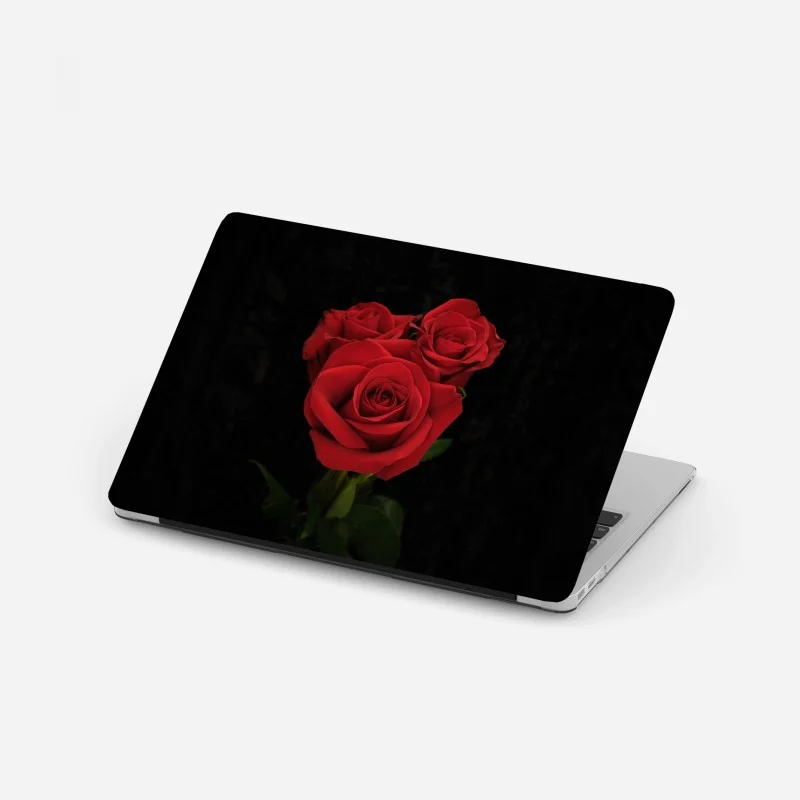 Laptop sticker red roses on black background