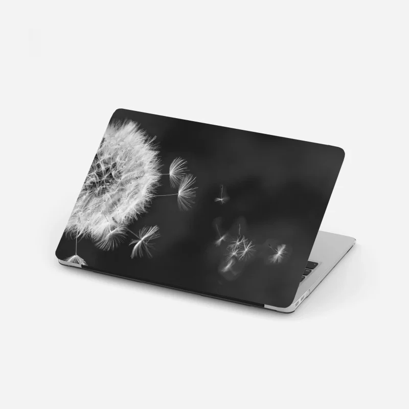 Laptop sticker floating dandelion seeds