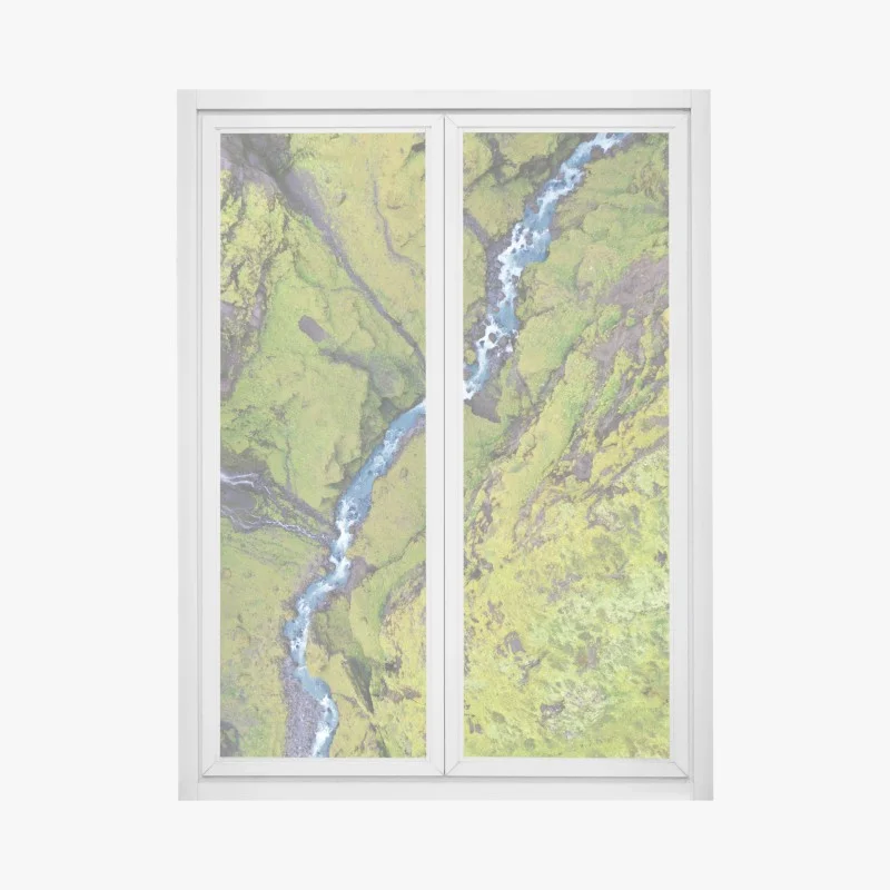 Window decal aerial river through mossy canyon