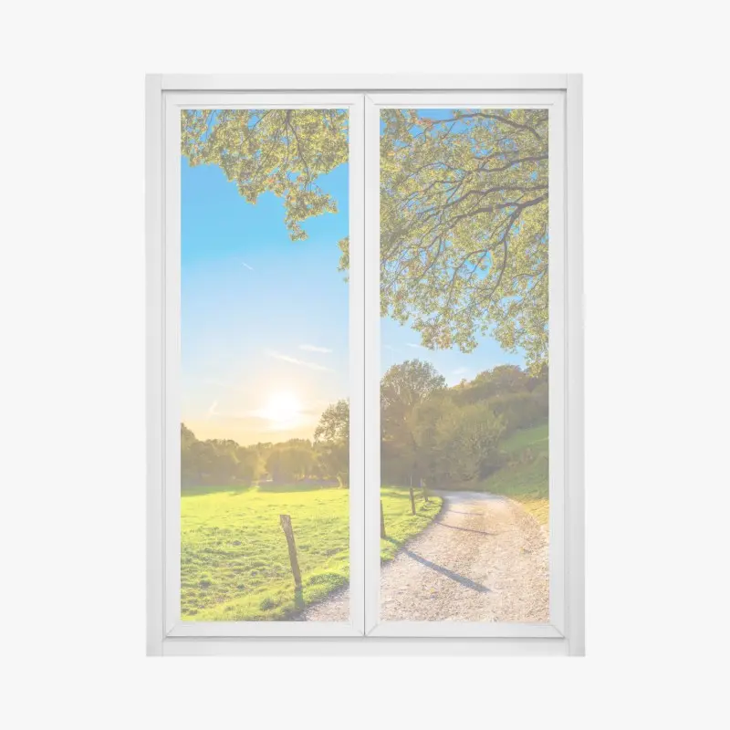 Window decal sunlit meadow country road at sunset
