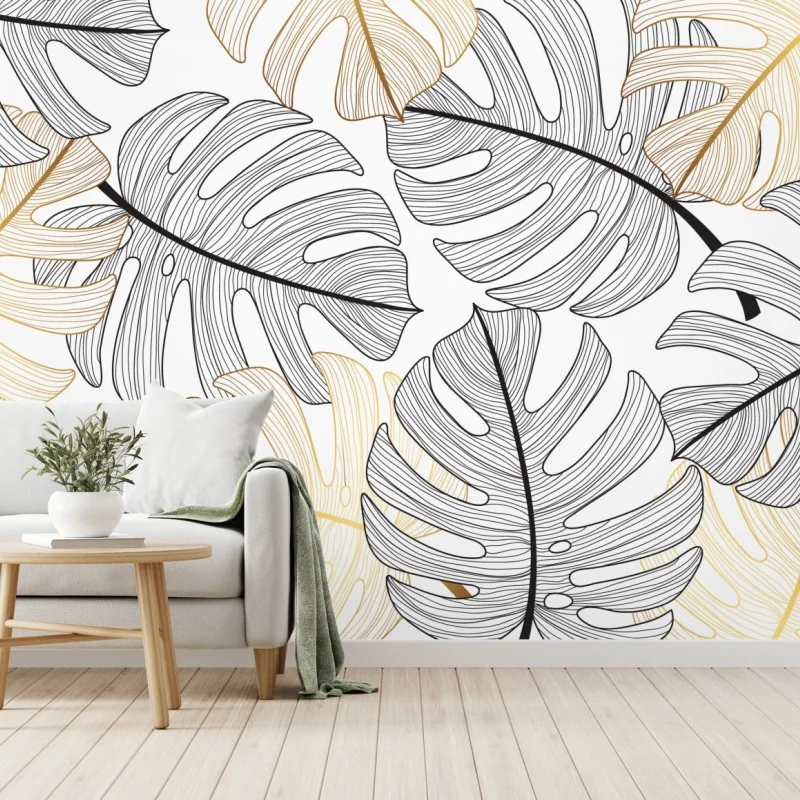 Wall mural monstera leaf pattern with gold accents