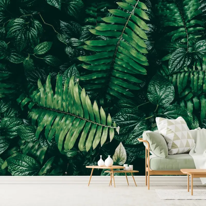 Wall mural lush tropical green leaves