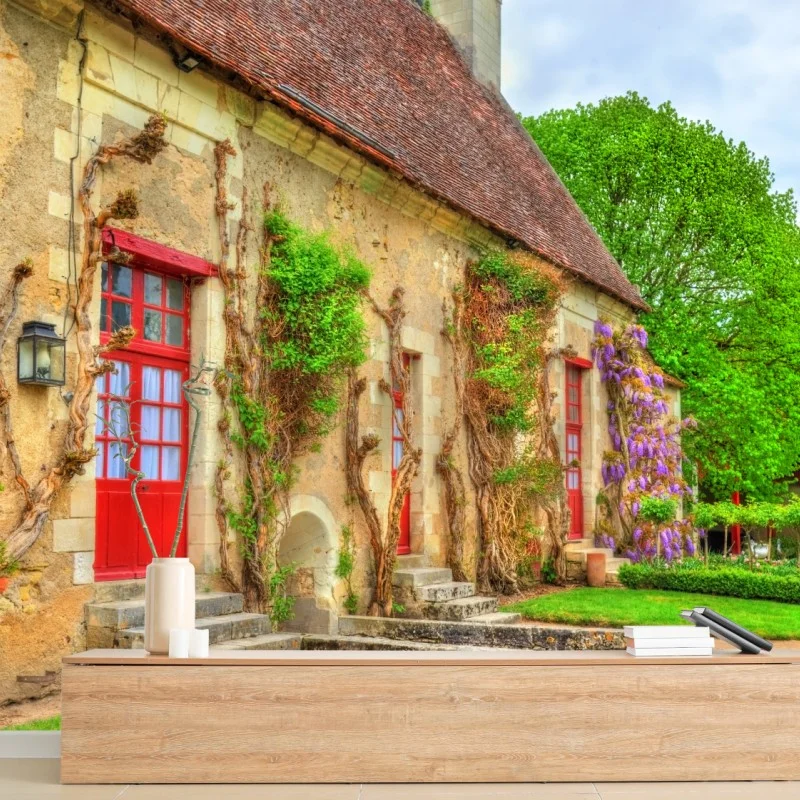 Wall mural charming cottage with wisteria in bloom