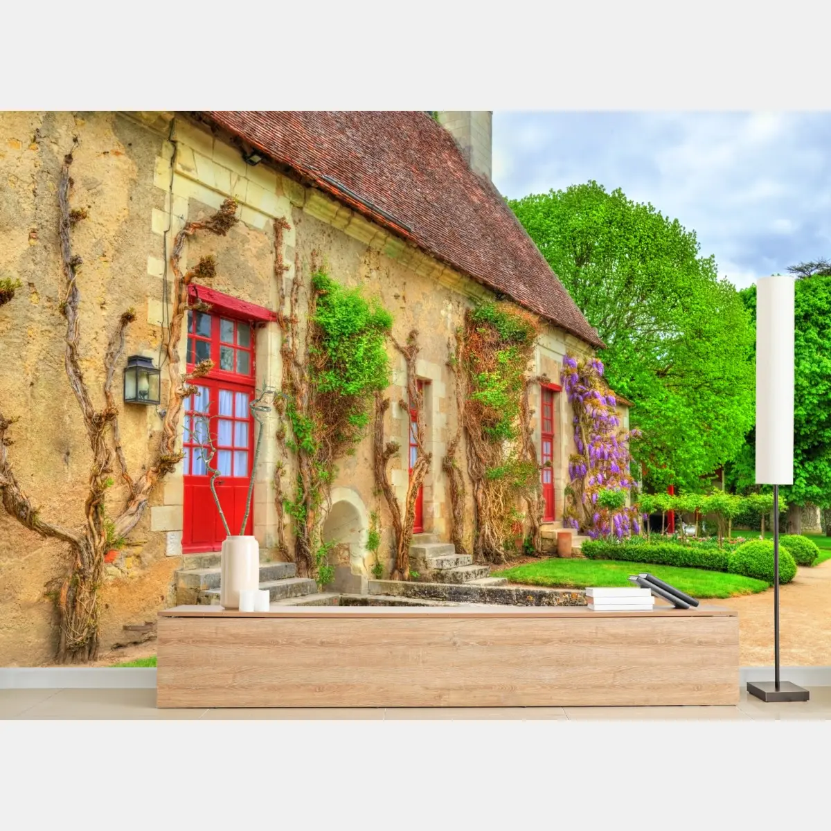 Wall mural charming cottage with wisteria in bloom • Wallissimo®