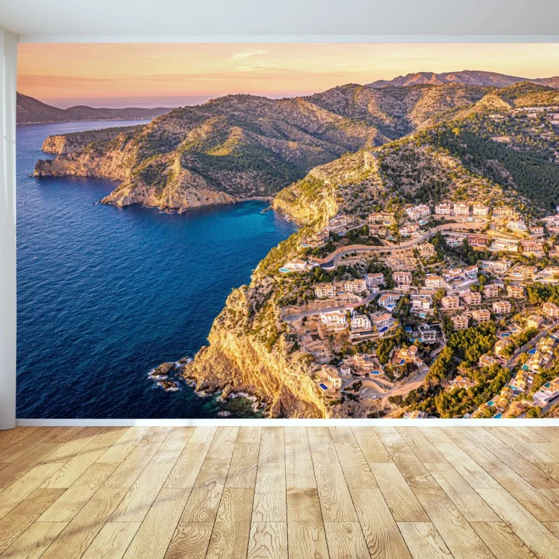 Wall mural sunset coastal landscape over cliffside village