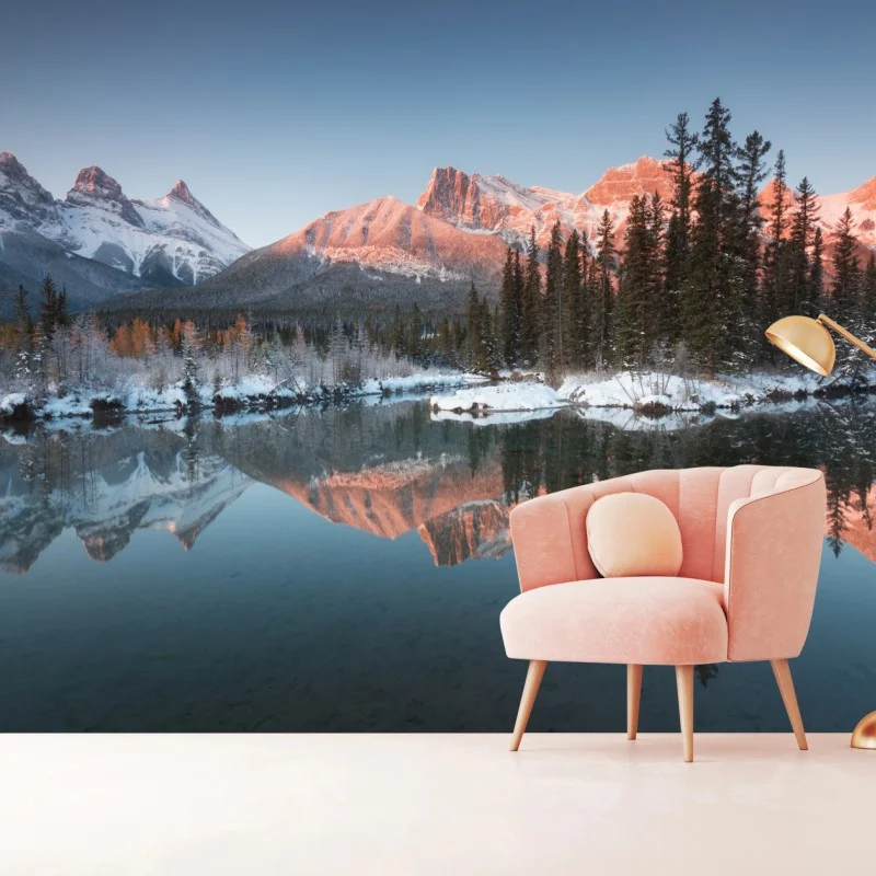 Wall mural sunlit mountain reflection at dawn