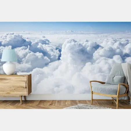 Wall mural view from above: soft clouds and blue sky • Wallissimo®