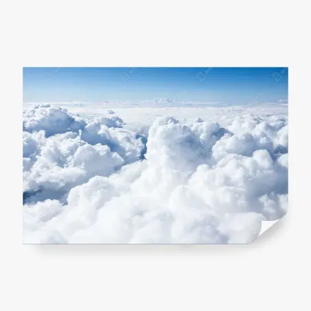 Wall mural view from above: soft clouds and blue sky • Wallissimo®