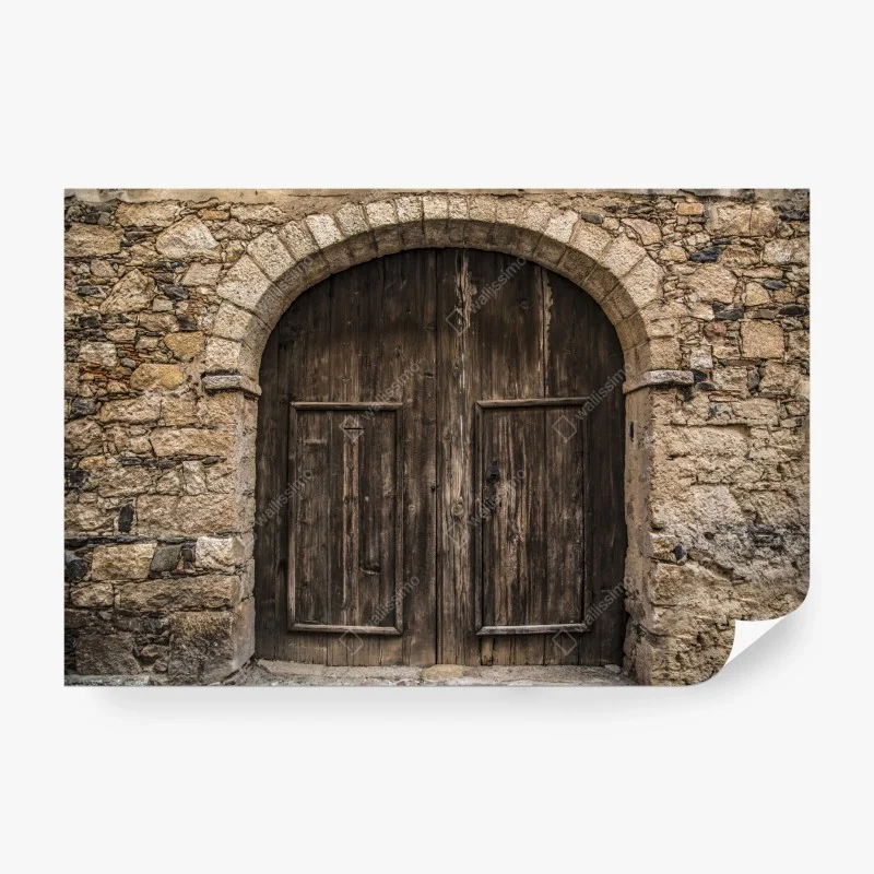 Wall mural rustic wooden door with stone arch
