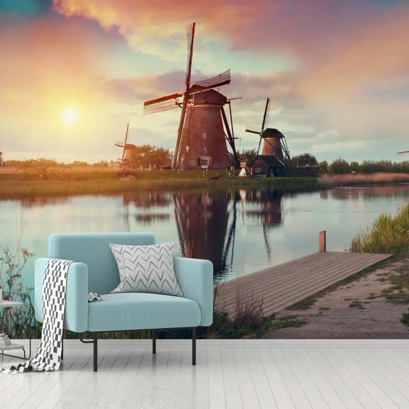Wall mural sunset over windmills in the Netherlands