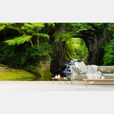 Wall mural hidden waterfall through a rock arch • Wallissimo®