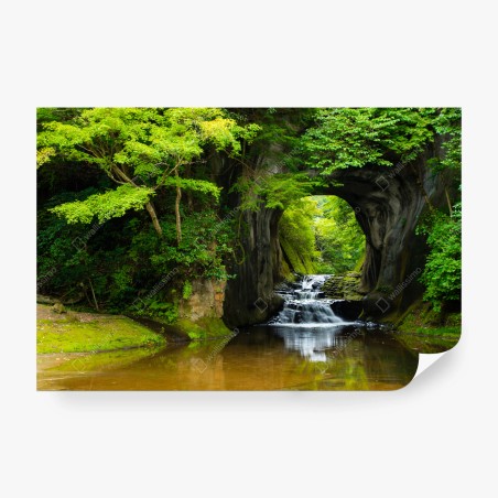 Wall mural hidden waterfall through a rock arch • Wallissimo®