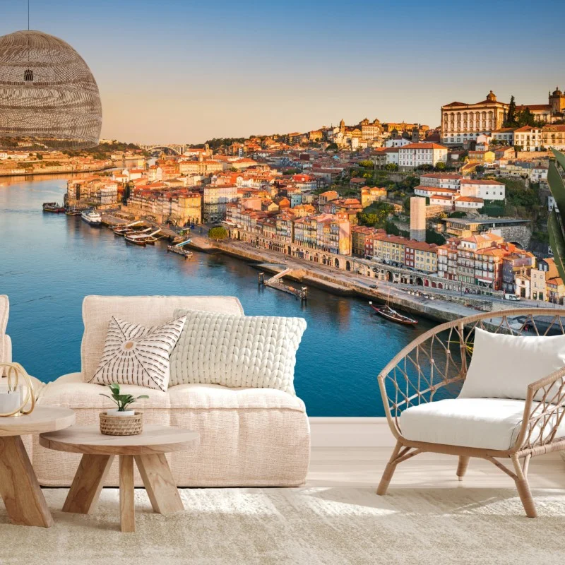 Wall mural sunlit Porto riverside skyline at golden hour