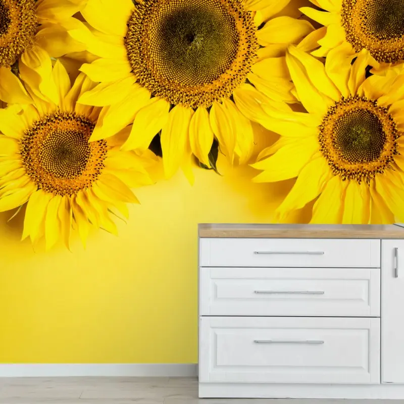 Wall mural bright sunflower bouquet on yellow background