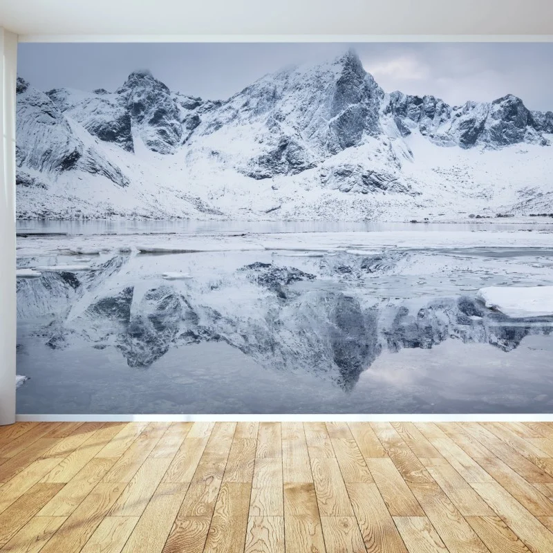 Wall mural snowy mountain ridge reflection in Norway