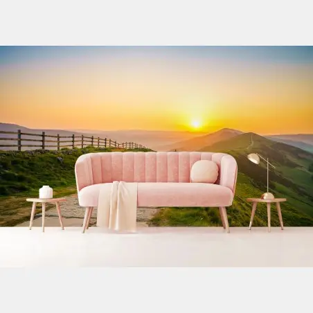 Wall mural sunlit mountain ridge at sunrise • Wallissimo®