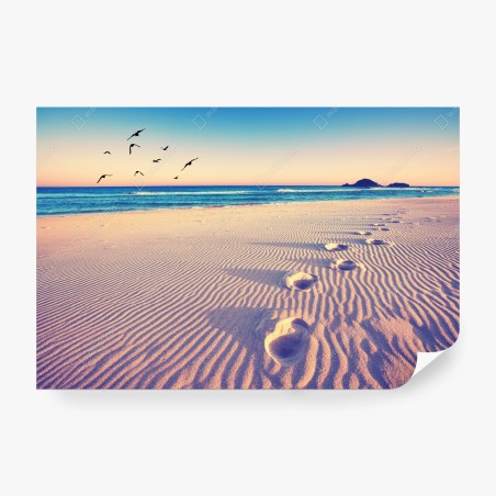 Wall mural magic footprints on a summer beach • Wallissimo®