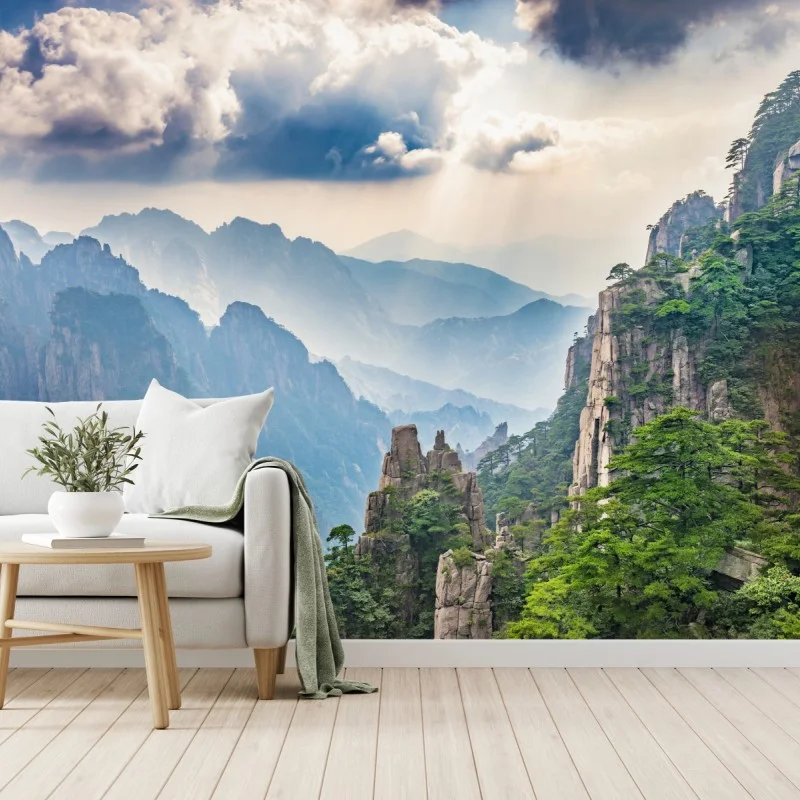 Wall mural misty mountain cliffs with sunrays