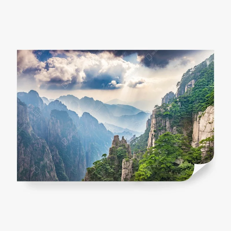Wall mural misty mountain cliffs with sunrays