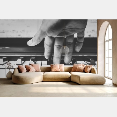Wall mural hand on piano keys in grayscale • Wallissimo®