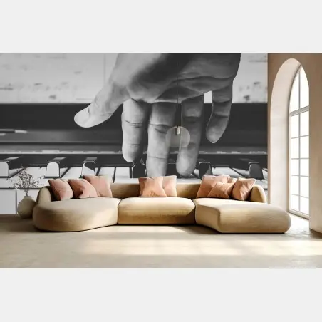Wall mural hand on piano keys in grayscale • Wallissimo®