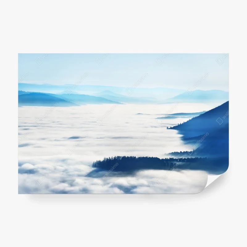 Wall mural misty mountain panorama over fog-filled valley