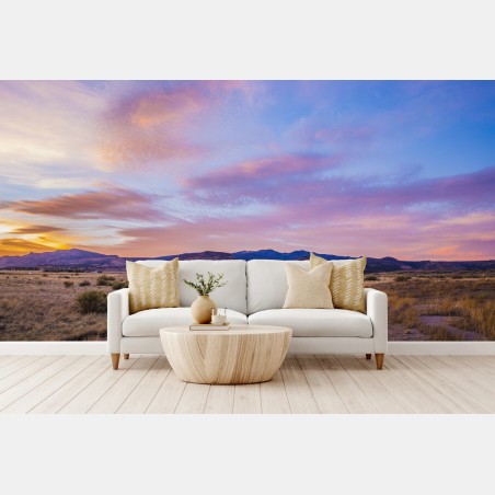 Wall mural pastel sunset over desert mountains • Wallissimo®