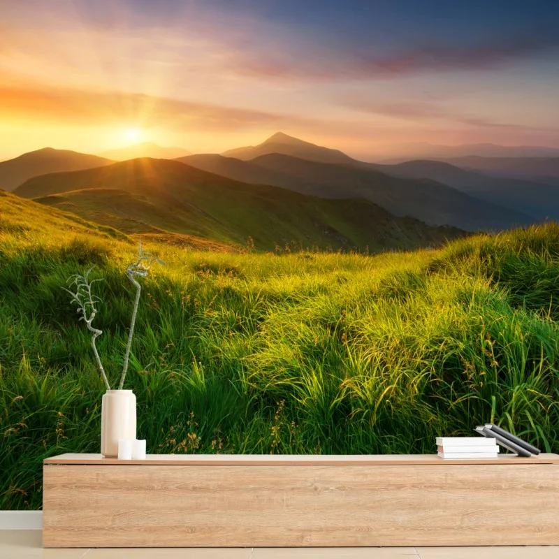Wall mural sunrise over emerald mountain valley