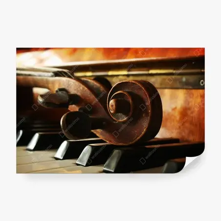 Wall mural vintage violin scroll on piano keys • Wallissimo®