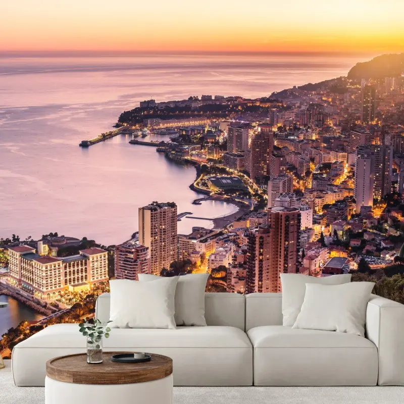 Wall mural sunset cityscape over coastal skyline