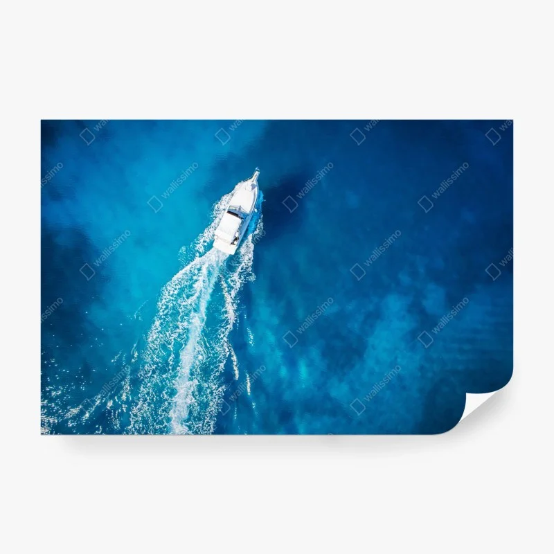 Wall mural aerial yacht in crystal blue ocean