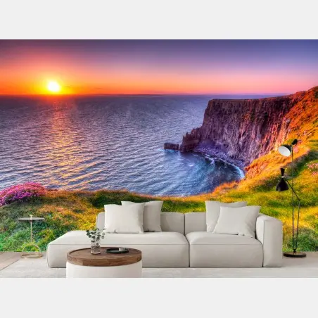 Wall mural sunset over rugged coastal cliffs • Wallissimo®