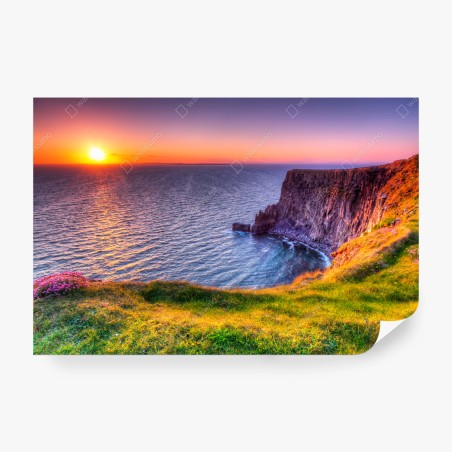 Wall mural sunset over rugged coastal cliffs • Wallissimo®